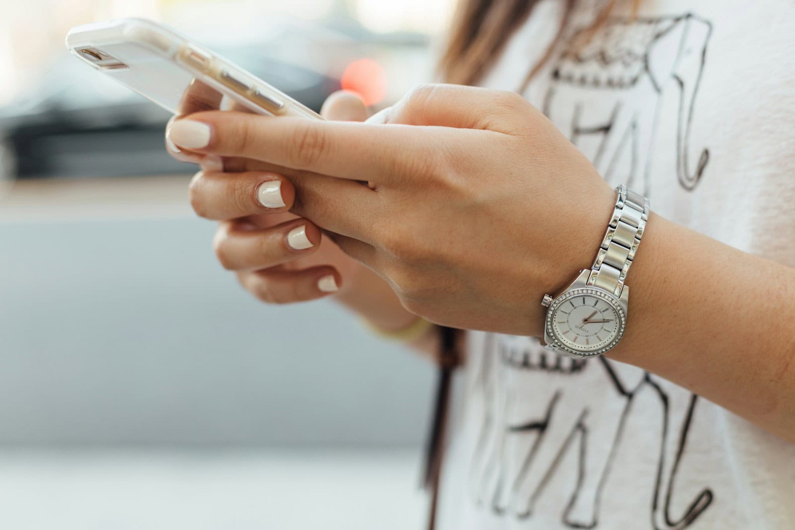 Loyalty Program, woman holding iPhone during daytime