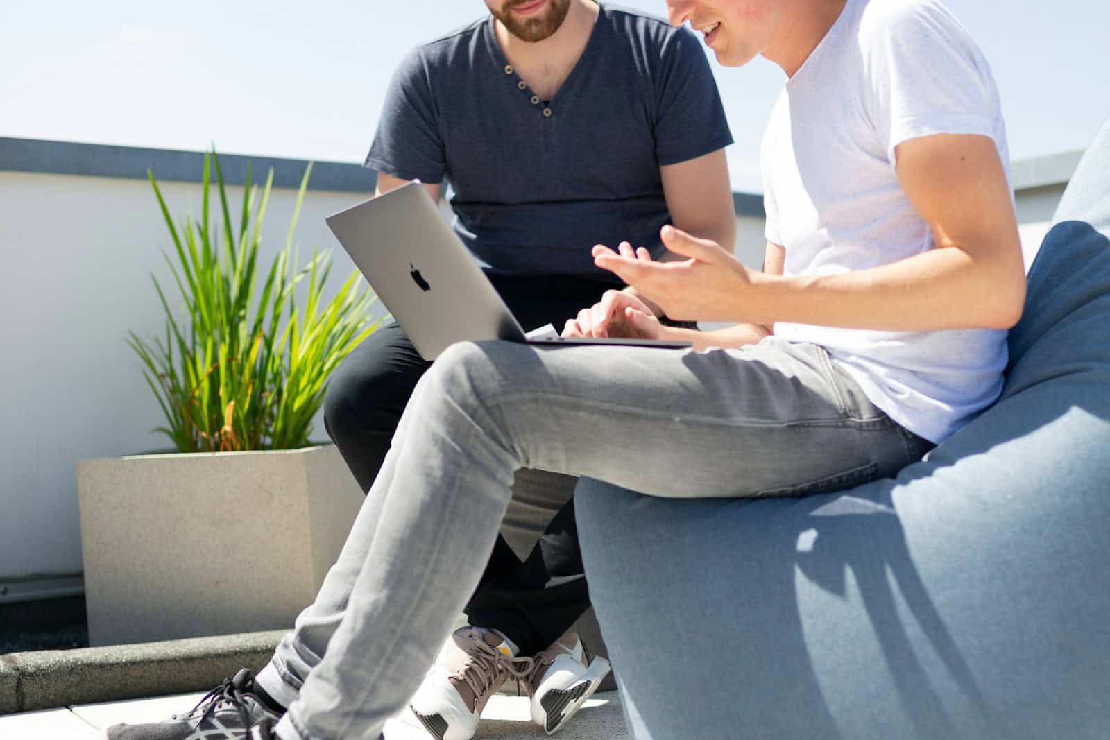 Fluent Boards, Project Management, WordPress, Fluent CRM, Kanban, Planning, Workflow, two figures with a laptop doing project management using a software interface. Person using MacBook